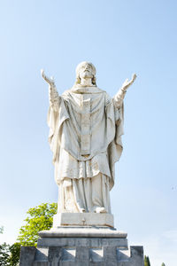 Low angle view of statue against sky