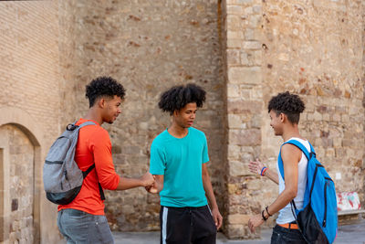 Group of people against wall in city