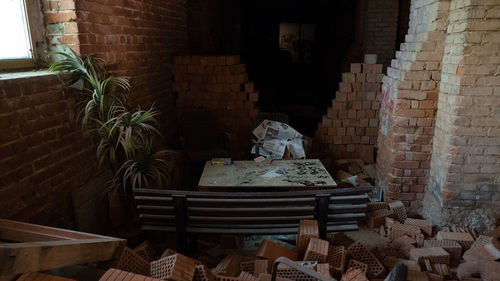 Chairs on wall of old building