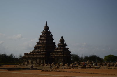 View of temple against building