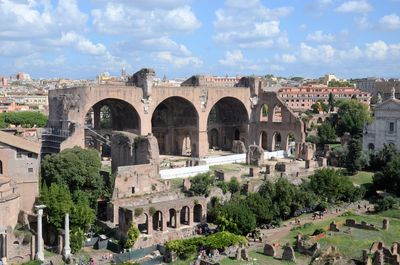 Basilica of maxentius and cityscape against sky