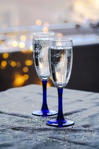 Close-up of champagne glass on table