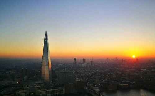 Aerial view of city at sunset