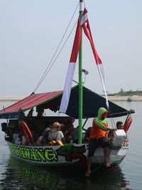 High angle view of people on boat against sky