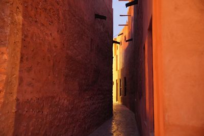 Narrow alley amidst buildings in city