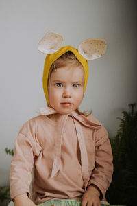 Toddler baby girl in funny hat with ears having fun