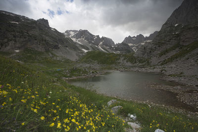 Scenic view of landscape and mountains against sky