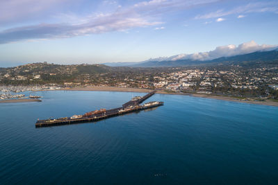 Santa barbara harbor and point castillo in background. pier in background.