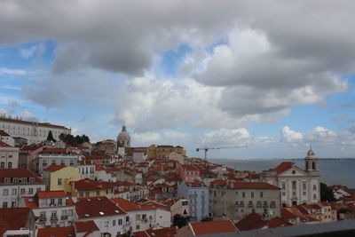 Houses in town against sky