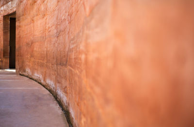 Close-up of footpath against wall