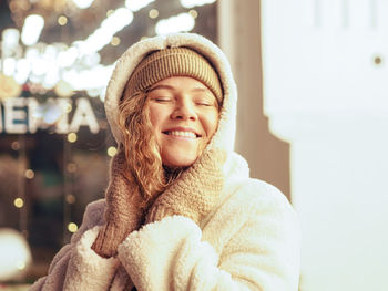 Portrait of young woman wearing hat