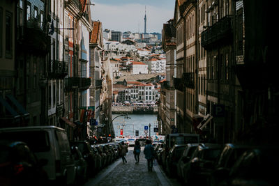 Narrow street amidst buildings in city