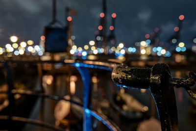 Close-up of illuminated railing at night