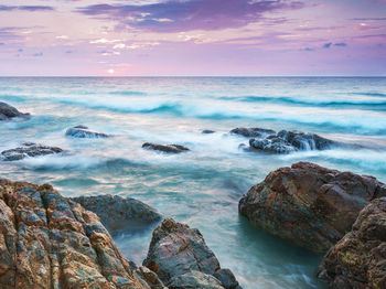 Scenic view of sea against sky during sunset