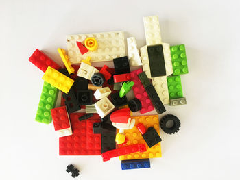 High angle view of toys on table against white background