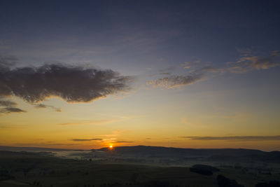 Scenic view of silhouette landscape against sky during sunset