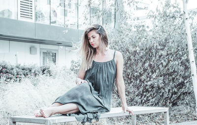 Young woman sitting outdoors