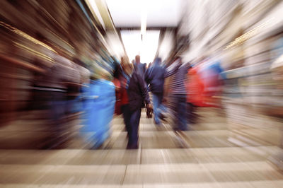 Blurred motion of people walking on subway station