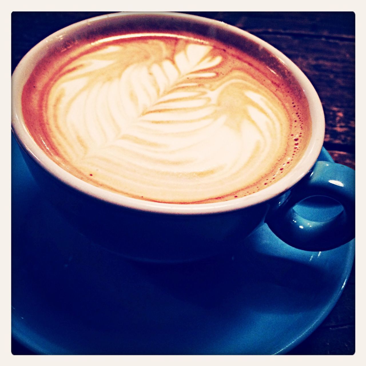 coffee cup, refreshment, drink, food and drink, coffee - drink, transfer print, indoors, coffee, saucer, frothy drink, freshness, cappuccino, froth art, still life, table, close-up, auto post production filter, cup, high angle view, directly above