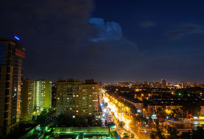 Scenic view of illuminated cityscape against sky at night