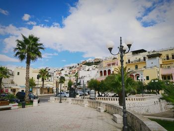 View of town against cloudy sky