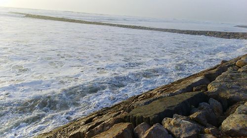 Scenic view of beach against sky