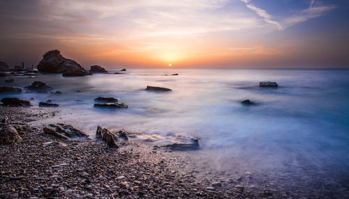 Scenic view of sea at sunset