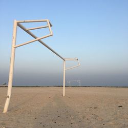 Lifeguard hut on beach against clear sky