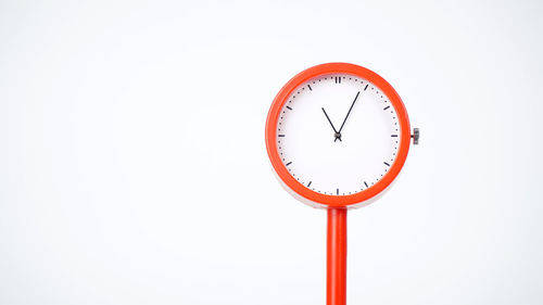 Close-up of clock against white background