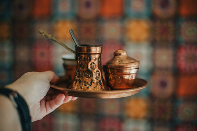 Close-up of person holding coffee