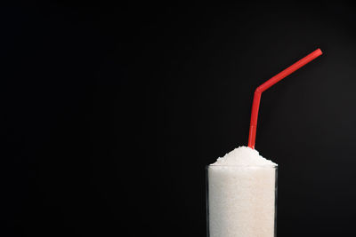 Close-up of drink against black background