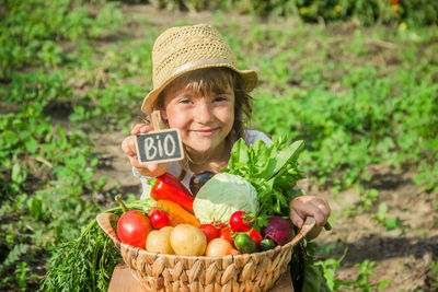 Portrait of young woman holding food