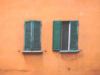 Close-up of window on orange wall