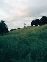 View of tower against cloudy sky