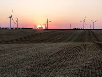 Scenic view of field against sky during sunset