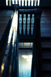 Close-up of railing against window