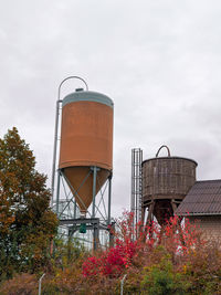 Low angle view of water tower against sky