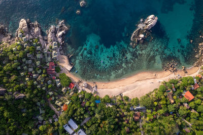 High angle view of townscape by sea