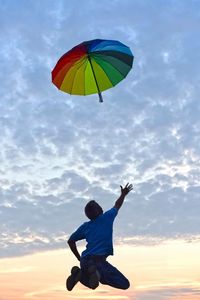 Rear view of a boy jumping