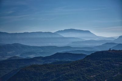 Scenic view of mountains against sky during foggy weather