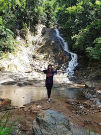 Full length of man standing on rock