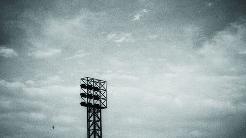 Low angle view of communications tower against sky