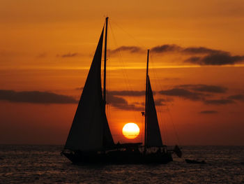 Silhouette of boats at sunset