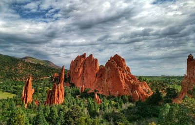 Rock formations at garden of the gods against cloudy sky