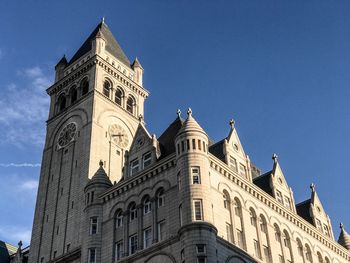 Low angle view of historical building against blue sky