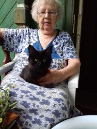 Portrait of woman sitting at home