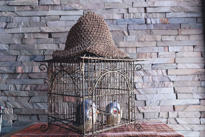 Stack of wicker basket against wall