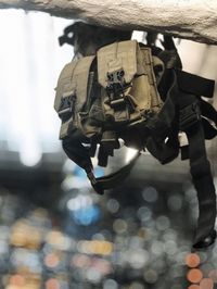 Close-up of camera hanging on cable