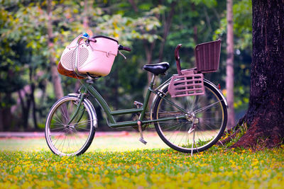 Bicycles in basket on field