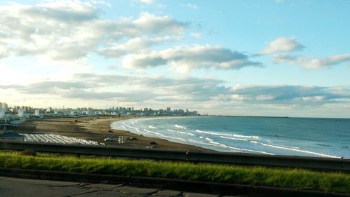 Scenic view of sea against cloudy sky